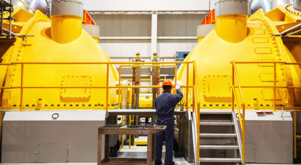 A worker at Pickering Nuclear working on a turbine